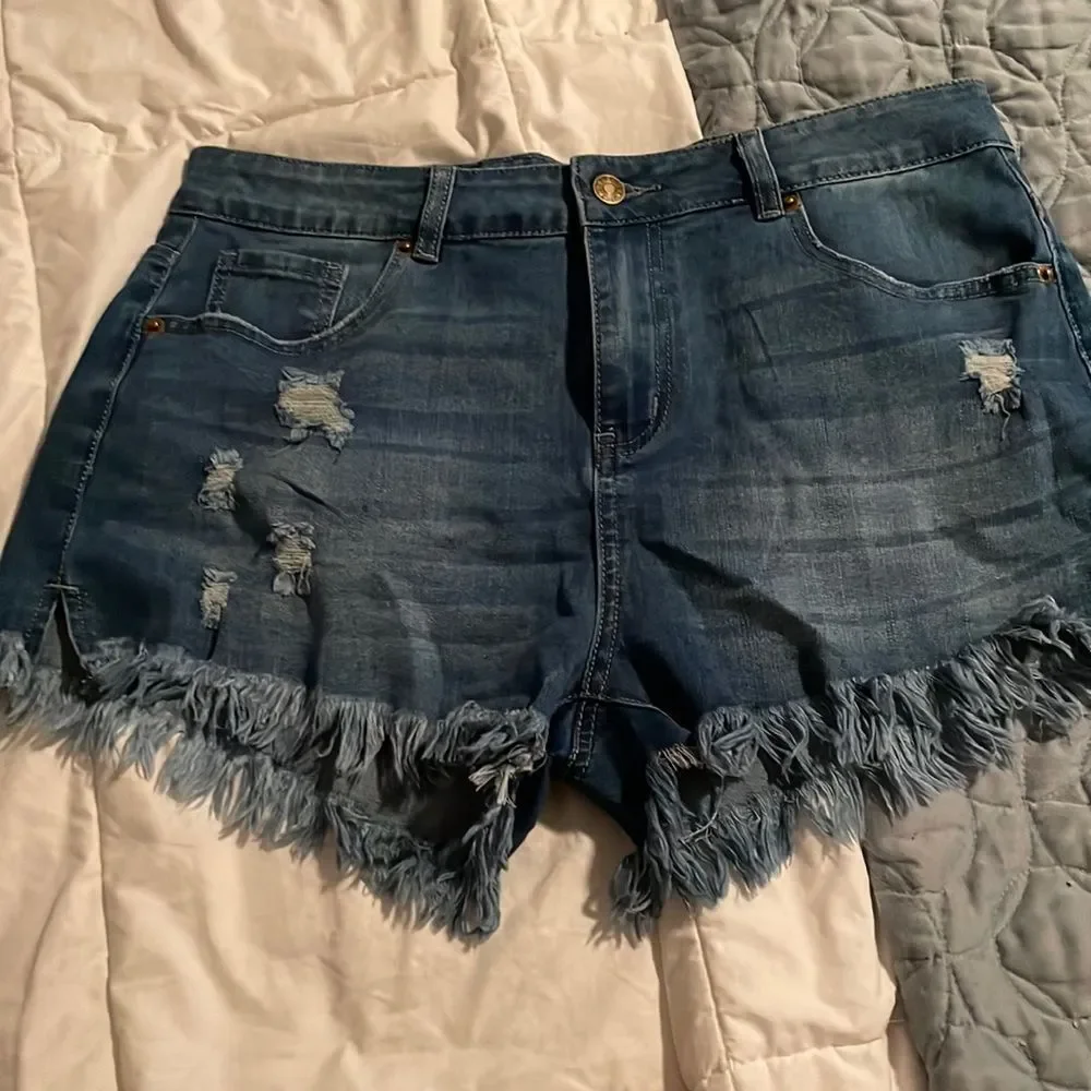 Size large cut off Jean shorts with fraying